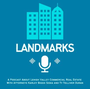 Illustration of a blue skyline with the word "LANDMARKS" and a microphone below it. Text reads: "A podcast about Lehigh Valley commercial real estate with attorneys Karley Biggs Sebia and Ty Tolliver Duran.